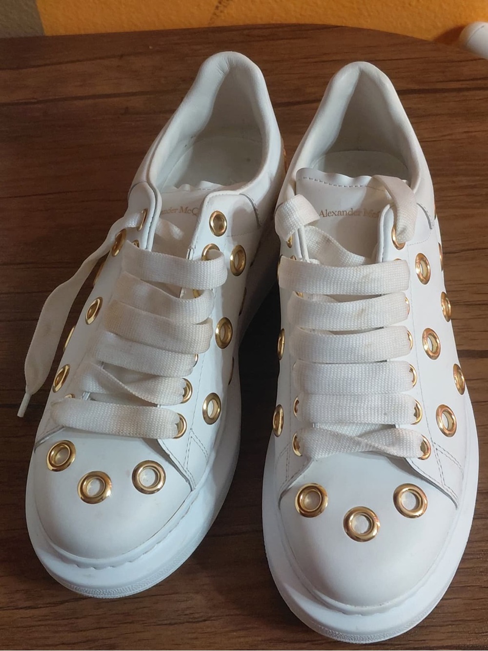 Alexander McQueen White Leather Sneakers with Gold Eyelet Detailing